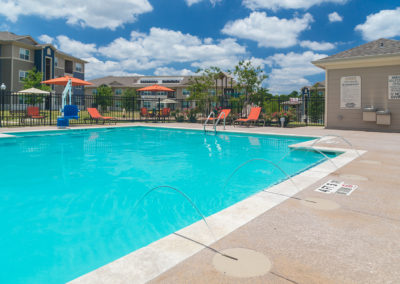 Pool area at Stallion Pointe apartments in Everman, TX