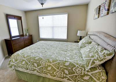 Master bedroom at Stallion Pointe Apartments with carpet flooring