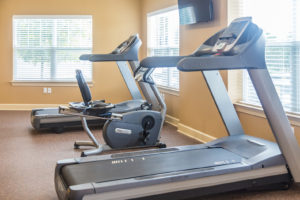 Treadmill, bike, and elliptical inside the Stallion Point fitness center